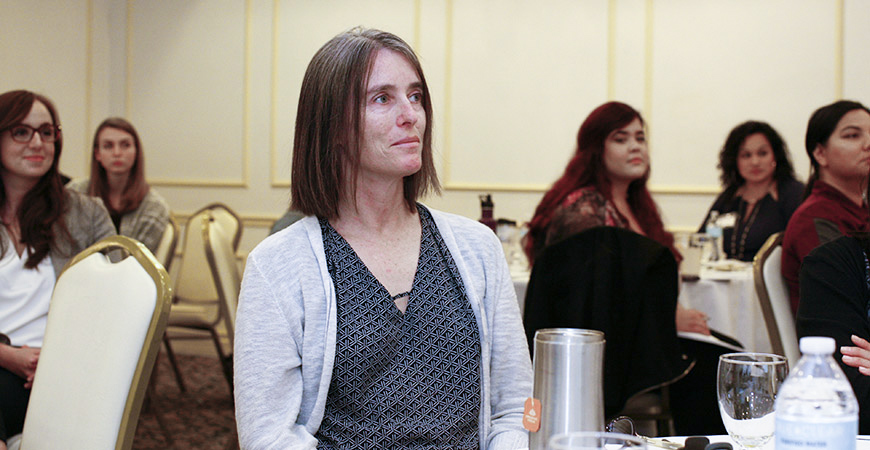 Faculty member and NCPC community research lead, Nancy Burke, listens to a presentation at the NCPC's workshop titled “Hook, Line & Sinker: Crafting Compelling Policy Messages.”